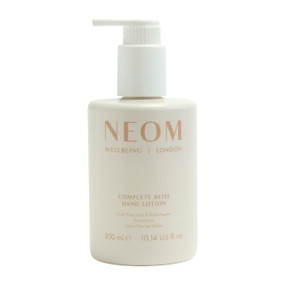 NEOM Wellbeing Complete Bliss Hand Lotion 300ml in a off-white plastic pump bottle; deeply nourishes and hydrates your hands